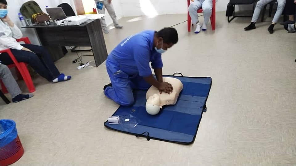 CPR training demonstration with a resuscitation dummy