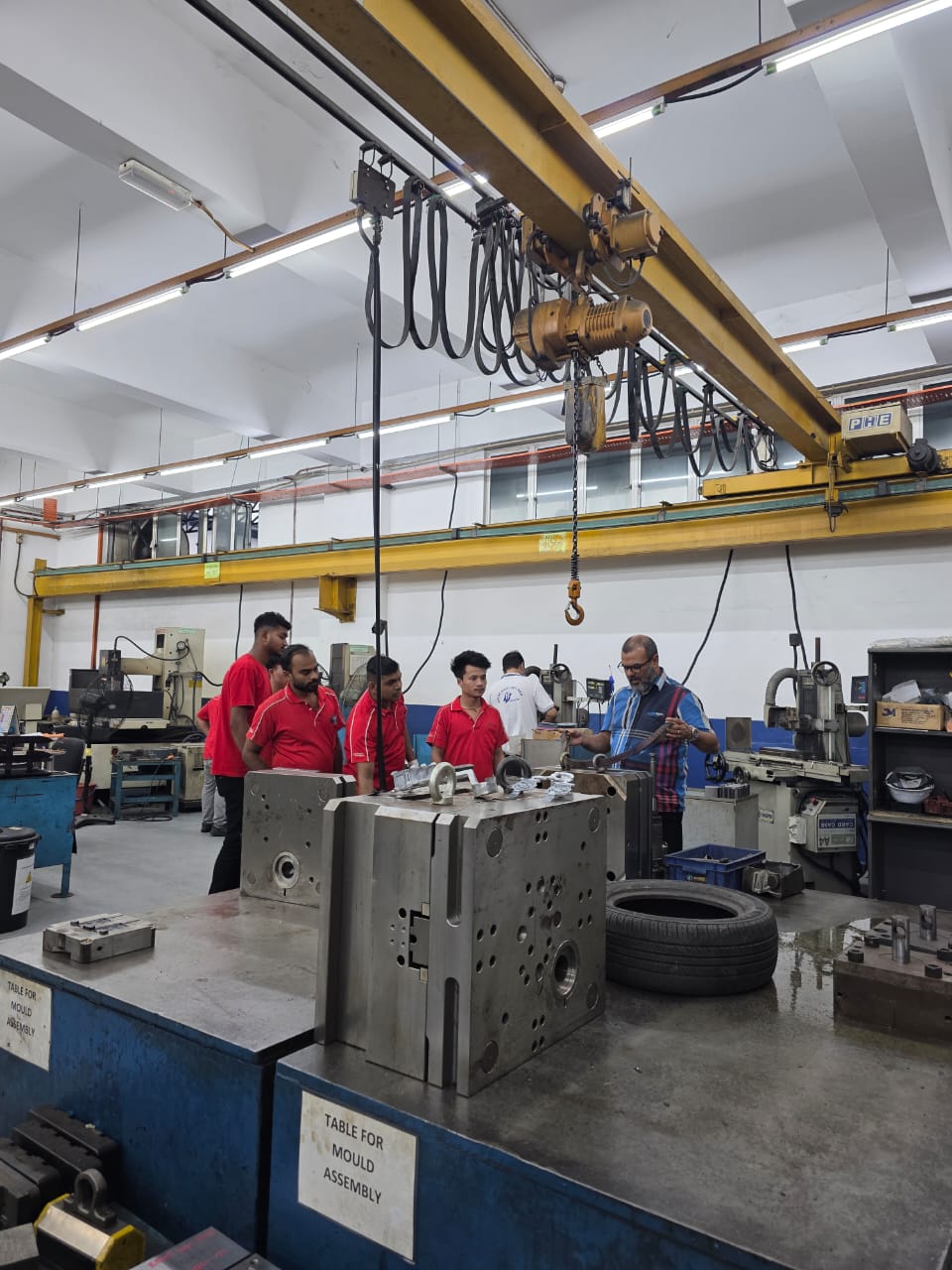 Overhead travelling crane safety training in a Malaysian mould-making workshop