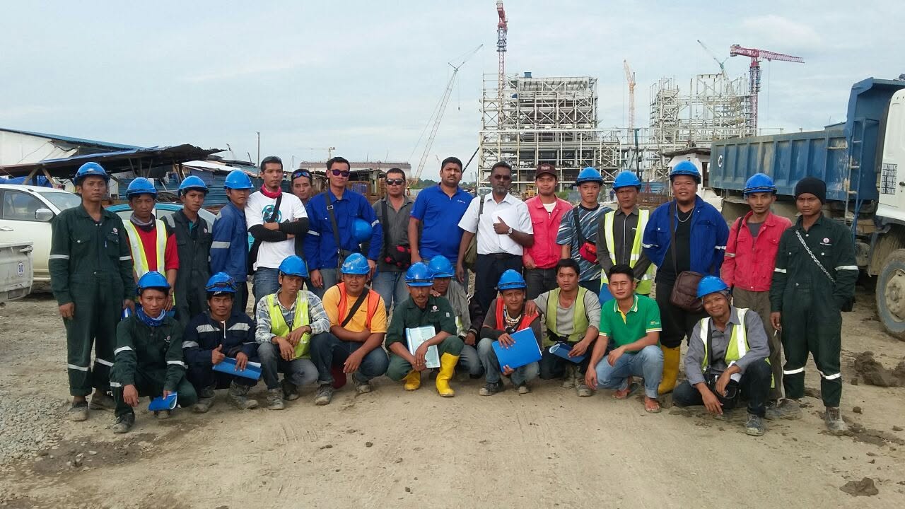 Construction crew in hard hats at an active building site